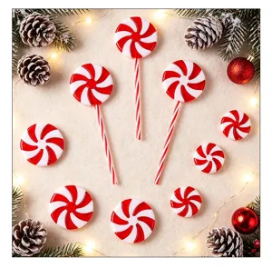 Close-up of red and white peppermint candy decorations with Christmas ornaments.