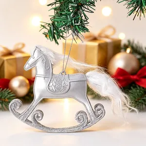 Silver rocking horse Christmas ornament with white fluffy mane hanging on tree