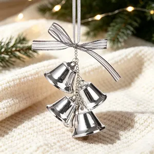 Set of silver metal Christmas bells ornament with an elegant striped bow decoration