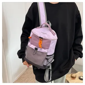 Detailed view of purple techwear backpack with mesh pockets and adjustable straps