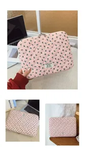 Close-up of pink floral quilted laptop sleeve featuring a decorative minimalist text label
