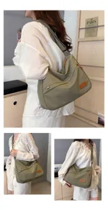 Vue détaillée d'un grand sac bandoulière en toile vert olive porté par un mannequin