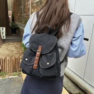 Casual black washed denim backpack for women with brown strap details for school