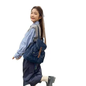Casual blue denim backpack for women featuring large capacity and vintage buckle