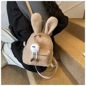 Mochila de peluche beige con orejas de conejo y colgante de pompón blanco suave