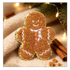 Detailed macro view of a fluffy gingerbread man chenille patch with gold glitter border.