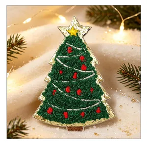 Detailed view of a green chenille Christmas tree embroidery patch with gold glitter.