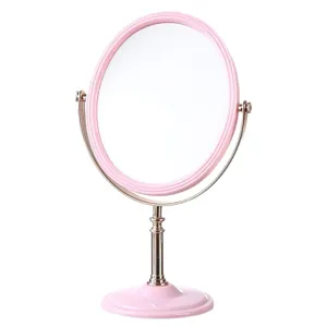Elegant pink oval double-sided rotating makeup mirror with gold electroplated stand