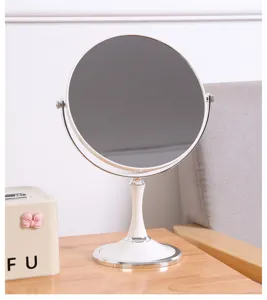 Moderner weißer Tisch-Make-up-Spiegel mit doppelseitig drehbarem hochauflösendem Glas.