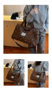 Details of quilted travel duffel bag, lightweight portable design for short trips and gym.