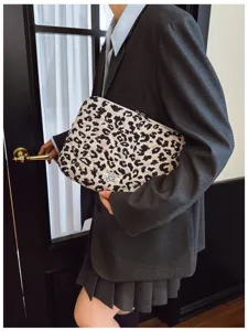 Leopard print laptop sleeve with quilted corduroy texture and brand label detail