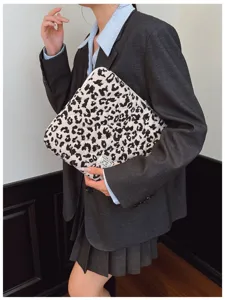 Lifestyle shot showing a trendy black and white leopard print laptop sleeve pouch
