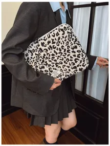 Close-up of stylish leopard print quilted laptop sleeve with a small white fabric label