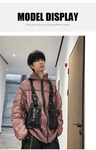 Asian male model wearing a black tactical vest chest bag over a purple jacket indoors