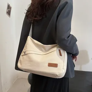 Sac bandoulière beige minimaliste de grande capacité pour un usage quotidien et scolaire