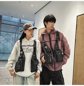 Detailed view of unisex tactical vest chest bag worn by models in urban setting