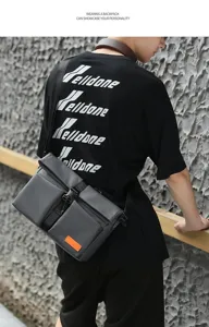 Men's gray waterproof messenger bag shown on model, perfect for casual or business use.