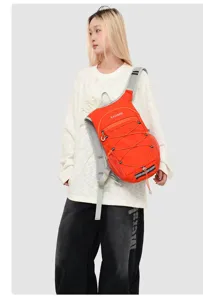 Lightweight orange outdoor hiking and running backpack shown on model for sports activities.