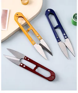 Close-up detail of high carbon steel U-shaped thread snips in vibrant assorted colors