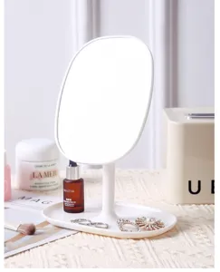 Minimalist white oval desk mirror with tray base showing elegant high-end vanity setup