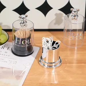 Elegant bear-topped storage box for toothpicks and cotton swabs on a wooden table