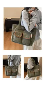 Detail view of large green corduroy tote bag with multiple pockets for daily commuting.
