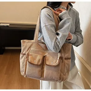 Casual khaki corduroy tote bag with multi-pocket design for commuting and daily use.