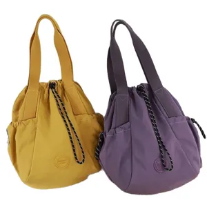 Stylish lightweight nylon drawstring tote bags for women in yellow and purple colors