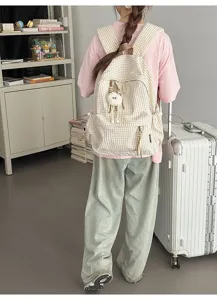 Casual Japanese style checkered backpack with large capacity for female college students.
