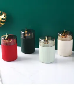 Automatic press-type toothpick holder in four luxury colors for elegant home storage.
