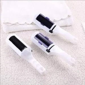 Detailed macro view of three large double-sided electrostatic lint remover brushes