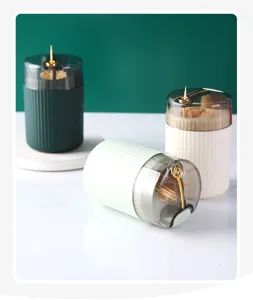 Three colors of portable press-type toothpick holders with gold accents and fluted design