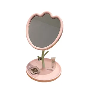 Eleganter rosa tulpenförmiger Tisch-Schminkspiegel mit integrierter Schmuckablage.