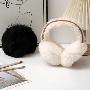 Cozy Korean style plush earmuffs in black and cream white for winter warmth