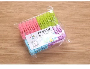 Detail view of 20pcs colorful plastic windproof clothespins in original packaging