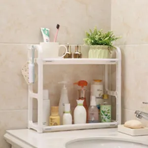 Detail of a 2-tier white plastic organizer rack used in a bathroom for various toiletries.