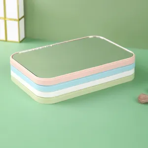 Set of four portable folding desktop makeup mirrors in pastel colors for dormitory vanity use