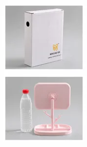 Specchio per il trucco rosa rotante confronto dimensioni con bottiglia d'acqua e box