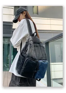 Woman wearing a stylish washed denim backpack for travel in a modern urban setting