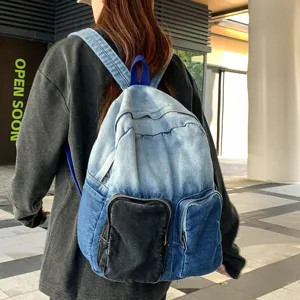 Chic blue gradient denim backpack for women shown on model in urban street setting