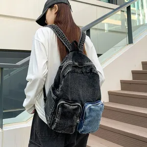 Female model wearing a black denim backpack with a contrast blue pocket on stairs