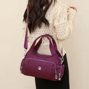 Large capacity purple nylon crossbody bag for women with multi-pocket design