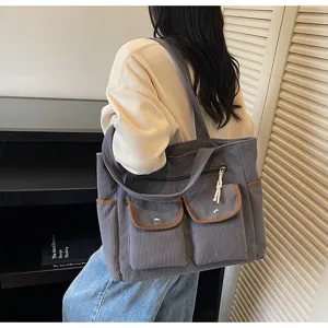 Large capacity grey corduroy tote bag with front pockets for stylish daily commuting use