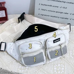 Close-up detail of a white waterproof nylon fanny pack with multiple zip pockets