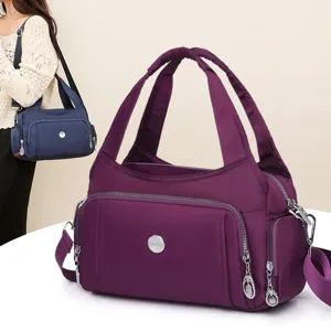 Water-repellent purple nylon handbag with multi-pockets and adjustable shoulder strap