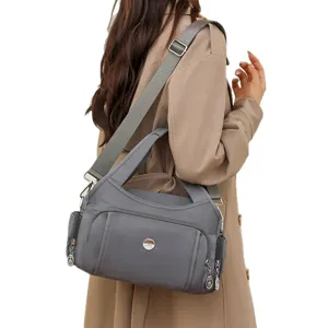 Lightweight waterproof gray nylon handbag with multi-functional pockets for travel