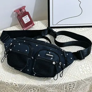 Detailed close-up of a black nylon fanny pack featuring white star patterns and mesh pockets.