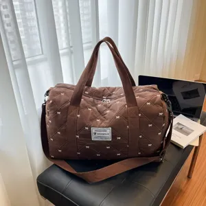 Brown quilted travel duffel bag with cute bows, lightweight gym handbag with shoulder strap.