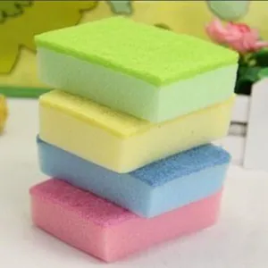 Set of four colorful double-sided sponges for kitchen cleaning and dishwashing