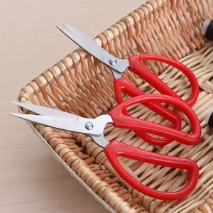 Sharp stainless steel household scissors with ergonomic red handles for office and craft